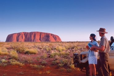 couples looking at uluru